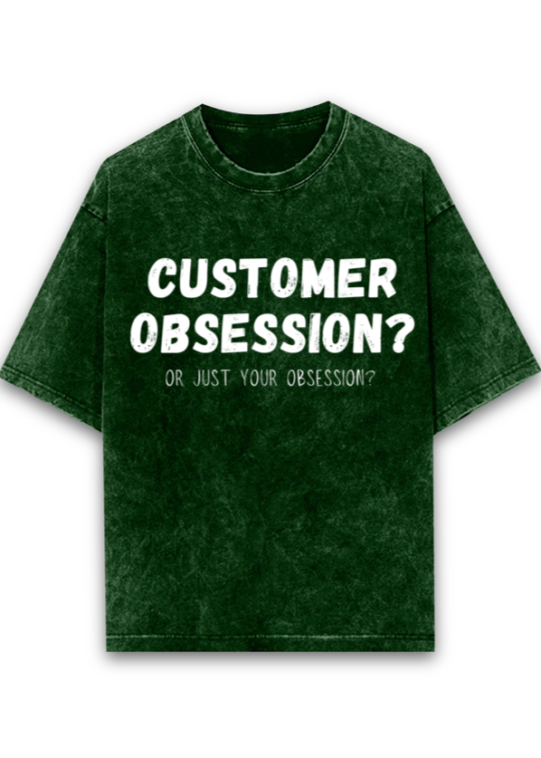 Bottle Green acid wash oversized T-shirt featuring 'Customer Obsession' design, great for developers, PMs, and software enthusiast, amazon leadership principle t shirt, tech company leadership principle funny meme and troll t shirts, make your subtle point.